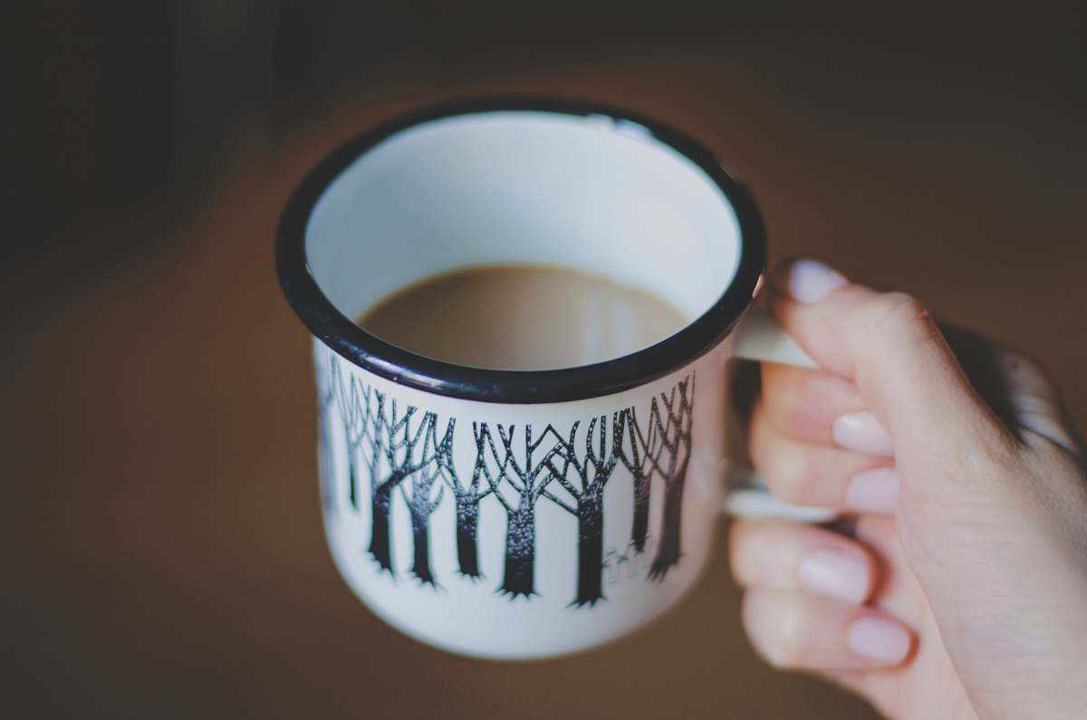 coffee cup white and black ceramic mug filled with coffee cup